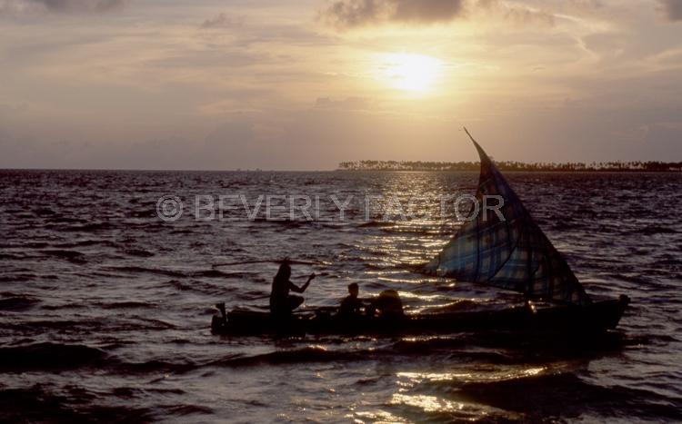 Island Sunsets;Wakatobi;Indonesia;sky;sillouettes;sunset;water;red;colorful;yellow;ocean;boats
